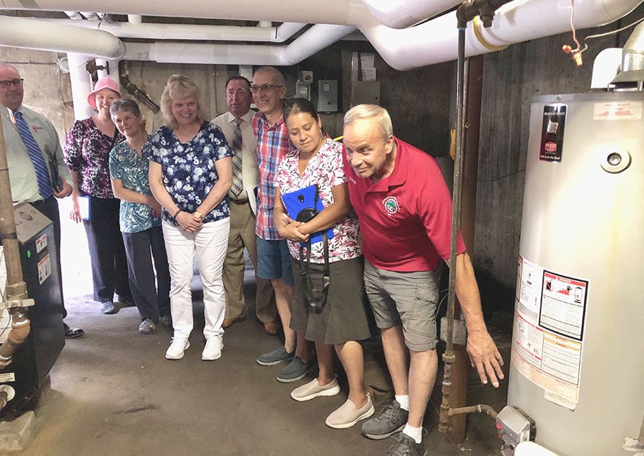 group of people admiring new boiler
