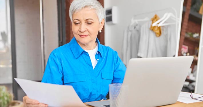 woman paying bill on computer