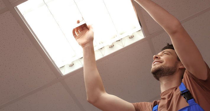 Man changing light bulb.