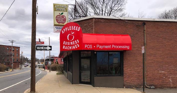 street corner showing brick exterior of Appleseed building