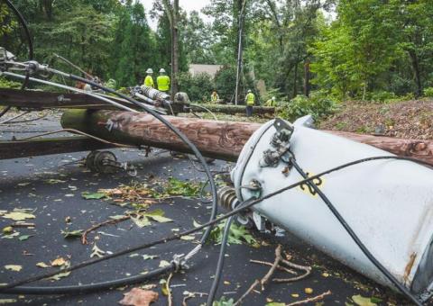 power line and broken utility pole on ground