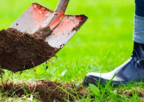 person digging with shovel